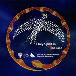 The logo for the NATSICC Assembly in is the middle of the screen with a deep blue background that looks like the night sky. The emblem is an Aboriginal painting with a red and orange snake forming a circle and a white bird features prominently.