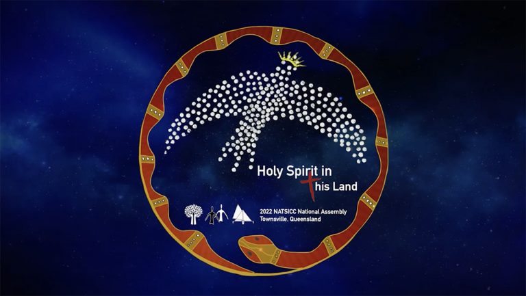 The logo for the NATSICC Assembly in is the middle of the screen with a deep blue background that looks like the night sky. The emblem is an Aboriginal painting with a red and orange snake forming a circle and a white bird features prominently.
