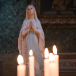 Statue of the Virgin Mary on an Altar with Candles
