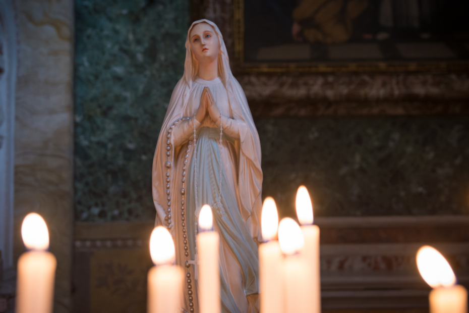 Statue of the Virgin Mary on an Altar with Candles