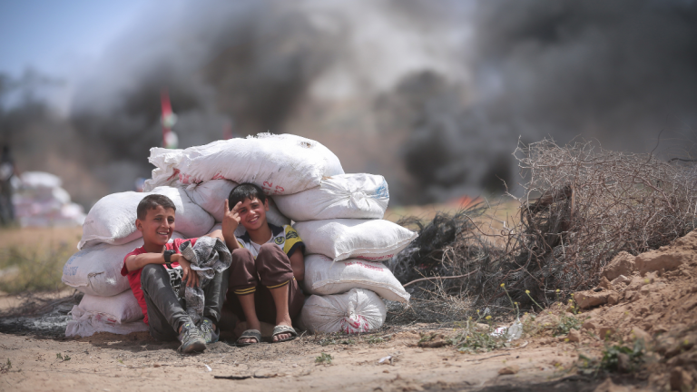 Two Young Children In Gaza, Smiling and Playing