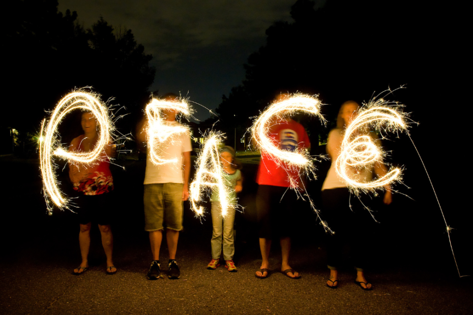 People forming the word Peace together